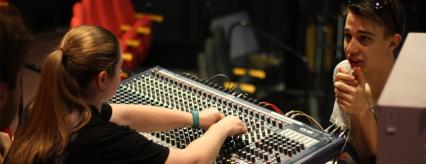 Live production students working on sound board